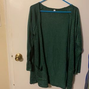 Woman’s dark green cardigan sweater